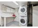 Laundry area with stackable washer and dryer at 3311 S Logan St, Englewood, CO 80113