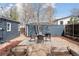Backyard features patio area, stone pavers, and a tidy yard at 3740 W 54Th Ave, Denver, CO 80221