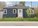 Charming home featuring a well-maintained lawn, a blossoming tree, and a neatly painted facade at 3740 W 54Th Ave, Denver, CO 80221