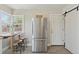 Bright kitchen featuring stainless steel appliances, an eat-in nook, and modern finishes at 3740 W 54Th Ave, Denver, CO 80221