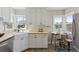 Charming kitchen features a farmhouse sink, butcher block counters, and an eat-in nook at 3740 W 54Th Ave, Denver, CO 80221