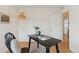 Home office area with a desk, chair, stylish lighting, and hardwood floors at 3740 W 54Th Ave, Denver, CO 80221