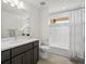 A neutral bathroom with a built-in tub and shower combo, and single sink vanity at 845 Eudora St, Denver, CO 80220