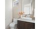 Modern powder room with vessel sink, floating vanity, and contemporary fixtures at 845 Eudora St, Denver, CO 80220