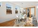 Bright dining room with hardwood floors, modern lighting, and sliding glass doors at 845 Eudora St, Denver, CO 80220