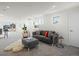 Open living space with great natural light, gray sofa, and dining area at 845 Eudora St, Denver, CO 80220