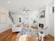 Bright living room with hardwood floors, fireplace, and neutral modern decor at 845 Eudora St, Denver, CO 80220