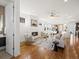 Bright open-plan living room featuring a fireplace, hardwood floors, and neutral tones at 845 Eudora St, Denver, CO 80220