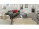 Living room with neutral walls, a gray sofa with accent pillows, and area rug at 845 Eudora St, Denver, CO 80220