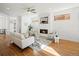 Bright living room featuring a fireplace, hardwood floors, and neutral tones at 845 Eudora St, Denver, CO 80220