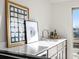 Modern wet bar featuring a stainless steel sink, quartz countertop, and stylish decor at 845 Eudora St, Denver, CO 80220