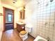 A bathroom with tile flooring, wood vanity and a shower at 1716 Virginia St, Idaho Springs, CO 80452