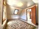 Upstairs bedroom with angled walls, unique window shape, and neutral carpet at 1716 Virginia St, Idaho Springs, CO 80452