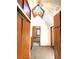 Upper level hallway features a unique skylight and doors leading to multiple bedrooms at 1716 Virginia St, Idaho Springs, CO 80452