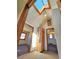 Upstairs hallway features a unique skylight and doors leading to multiple bedrooms at 1716 Virginia St, Idaho Springs, CO 80452