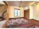 Cozy living room featuring a fireplace, natural light, and area rug for added comfort at 1716 Virginia St, Idaho Springs, CO 80452