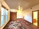 Bright living room with large windows, wood trim and an area rug adds warmth and character at 1716 Virginia St, Idaho Springs, CO 80452