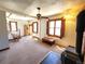 Bright living room featuring a wood-burning stove, wood trim and many windows at 1716 Virginia St, Idaho Springs, CO 80452
