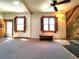 Spacious living room with wood burning fireplace and large windows with wood trim at 1716 Virginia St, Idaho Springs, CO 80452