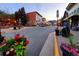 Scenic street view featuring downtown businesses, lush flower arrangements, and a vibrant mountain backdrop at 1716 Virginia St, Idaho Springs, CO 80452