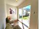 Bright sunroom featuring tile floor and sliding glass doors that open to the backyard at 1716 Virginia St, Idaho Springs, CO 80452