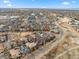 An aerial view of a neighborhood with a home highlighted with a red circle at 8044 E 24Th Ave, Denver, CO 80238