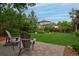 Relaxing backyard patio area with comfortable seating, perfect for enjoying the serene outdoor setting at 8044 E 24Th Ave, Denver, CO 80238