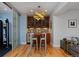 Stylish bar area features modern lighting, wooden cabinets, and seating, perfect for entertaining guests at 8044 E 24Th Ave, Denver, CO 80238