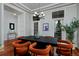 Elegant dining room features modern chandelier, large windows, and seating for six at 8044 E 24Th Ave, Denver, CO 80238