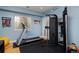 Well-equipped exercise room featuring a treadmill and multi-functional weight machine at 8044 E 24Th Ave, Denver, CO 80238