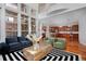 Open floor plan with hardwood floors, many windows and kitchen at 8044 E 24Th Ave, Denver, CO 80238