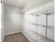 Large closet with wire shelving providing ample storage space at 1428 S De Gaulle Ct, Aurora, CO 80018