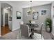 Bright dining room with chandelier and view of kitchen at 1428 S De Gaulle Ct, Aurora, CO 80018