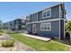 Two-story house exterior, showcasing a gray siding and backyard at 1428 S De Gaulle Ct, Aurora, CO 80018