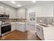 Modern kitchen with stainless steel appliances and stylish backsplash at 1428 S De Gaulle Ct, Aurora, CO 80018