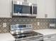 Stainless steel microwave above a matching range at 1428 S De Gaulle Ct, Aurora, CO 80018