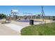 Community playground with playset, swings, and windmill at 1428 S De Gaulle Ct, Aurora, CO 80018