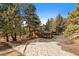 Secluded log cabin with snow-covered surroundings, offering a rustic and private retreat at 121 Mary Beth Rd, Evergreen, CO 80439