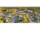 Neighborhood with tree-lined streets and various home styles, in a suburban area with apartments in the background at 3541 Eudora St, Denver, CO 80207