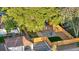 An aerial shot of a home with a tree-lined backyard and fenced-in yard, with a patio area at 3541 Eudora St, Denver, CO 80207