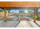 Covered backyard patio and entertaining space with a firepit and wooden fence at 3541 Eudora St, Denver, CO 80207