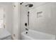Modern bathroom featuring a tiled shower with updated fixtures at 3541 Eudora St, Denver, CO 80207