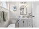 Clean and modern bathroom with a white vanity and elegant fixtures at 3541 Eudora St, Denver, CO 80207