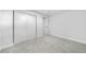 Bright, carpeted bedroom with a sliding-door closet and white walls at 3541 Eudora St, Denver, CO 80207