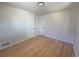 Large empty bedroom with hardwood floors at 3541 Eudora St, Denver, CO 80207