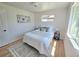 Cozy bedroom with natural light and a minimalist aesthetic at 3541 Eudora St, Denver, CO 80207