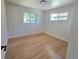Empty bedroom featuring hardwood floors and bright natural light at 3541 Eudora St, Denver, CO 80207