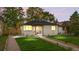 Charming home with lush green lawn and inviting front porch, showcasing its appealing curb appeal at 3541 Eudora St, Denver, CO 80207