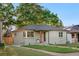 An inviting front yard and classic single story architecture makes this home appealing at 3541 Eudora St, Denver, CO 80207