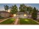 Charming home with a well-manicured lawn and a cozy patio area at 3541 Eudora St, Denver, CO 80207